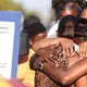 Debra Ray (L), aunt of Dijon Kizzee, is embraced after speaking near a makeshift memorial where Dijon Kizzee, a 29-year-old Black man, was killed by Los Angeles sheriff’s deputies in South Los Angeles on September 1, 2020 in Los Angeles, California. Protesters marched to the South Los Angeles Sheriffs’ Station to demonstrate for a second day after Kizzee was killed in an altercation after being stopped by police while riding his bicycle.